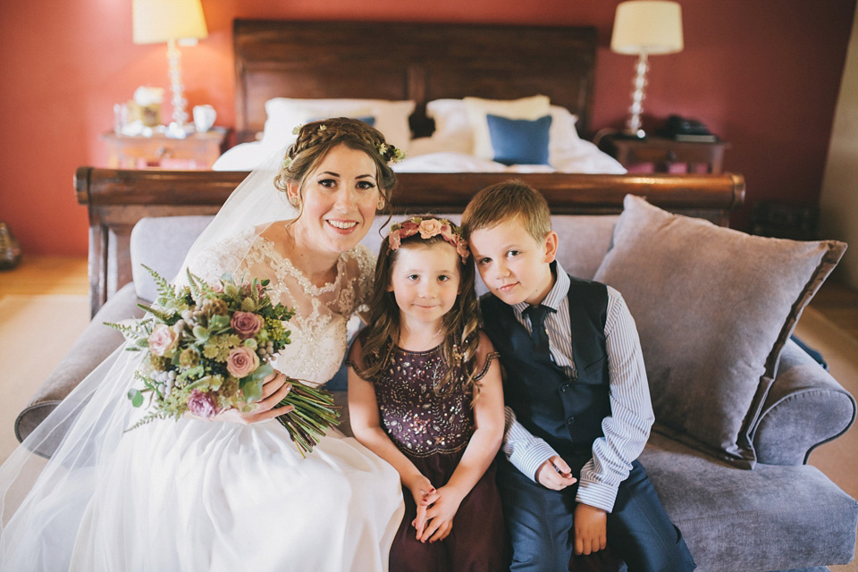 An elegant rustic Autumn wedding with a bride wearing flowers in her hair. Photography by Sally T.