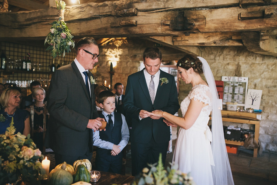 An elegant rustic Autumn wedding with a bride wearing flowers in her hair. Photography by Sally T.