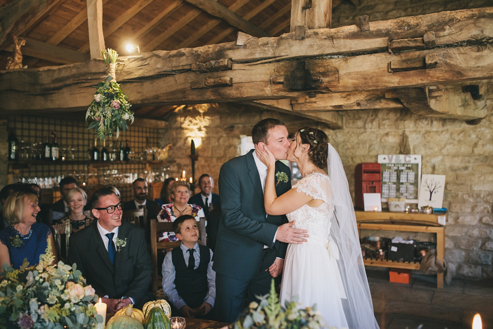 An elegant rustic Autumn wedding with a bride wearing flowers in her hair. Photography by Sally T.