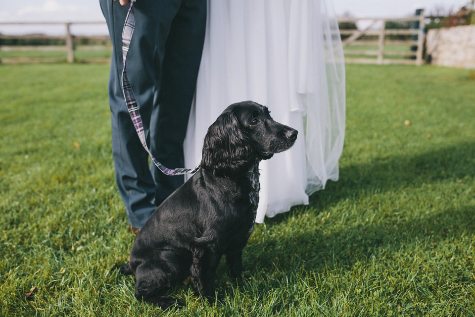 An elegant rustic Autumn wedding with a bride wearing flowers in her hair. Photography by Sally T.