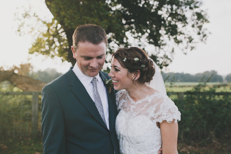 An elegant rustic Autumn wedding with a bride wearing flowers in her hair. Photography by Sally T.