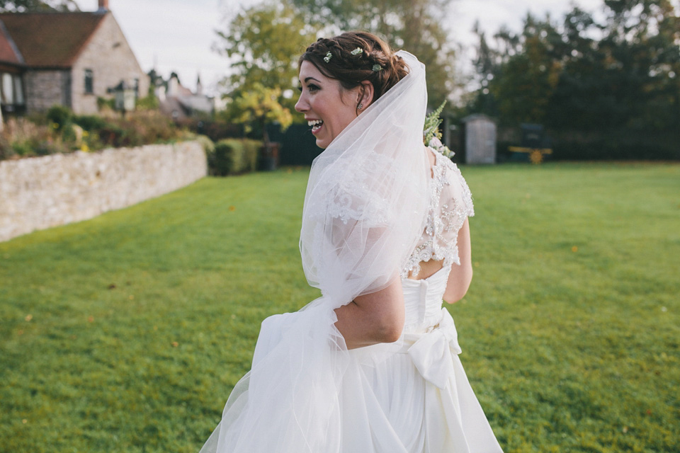 An elegant rustic Autumn wedding with a bride wearing flowers in her hair. Photography by Sally T.