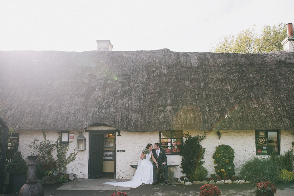 An elegant rustic Autumn wedding with a bride wearing flowers in her hair. Photography by Sally T.