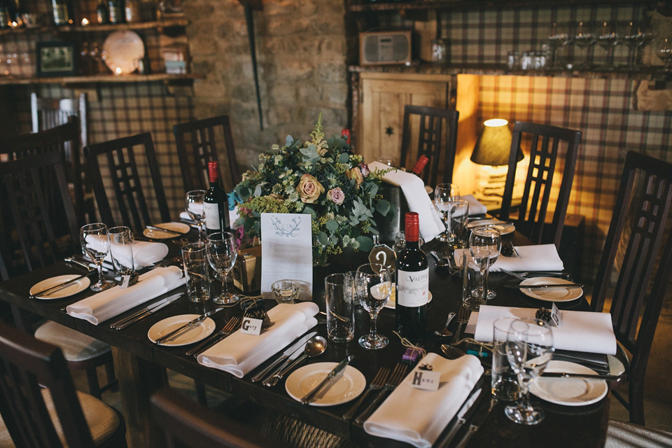 An elegant rustic Autumn wedding with a bride wearing flowers in her hair. Photography by Sally T.