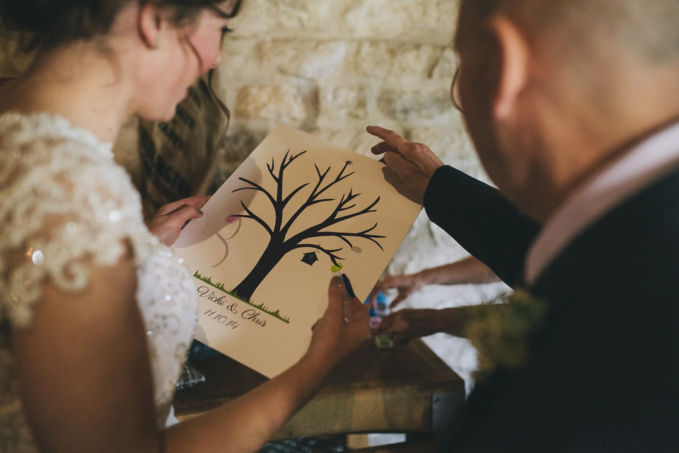 An elegant rustic Autumn wedding with a bride wearing flowers in her hair. Photography by Sally T.