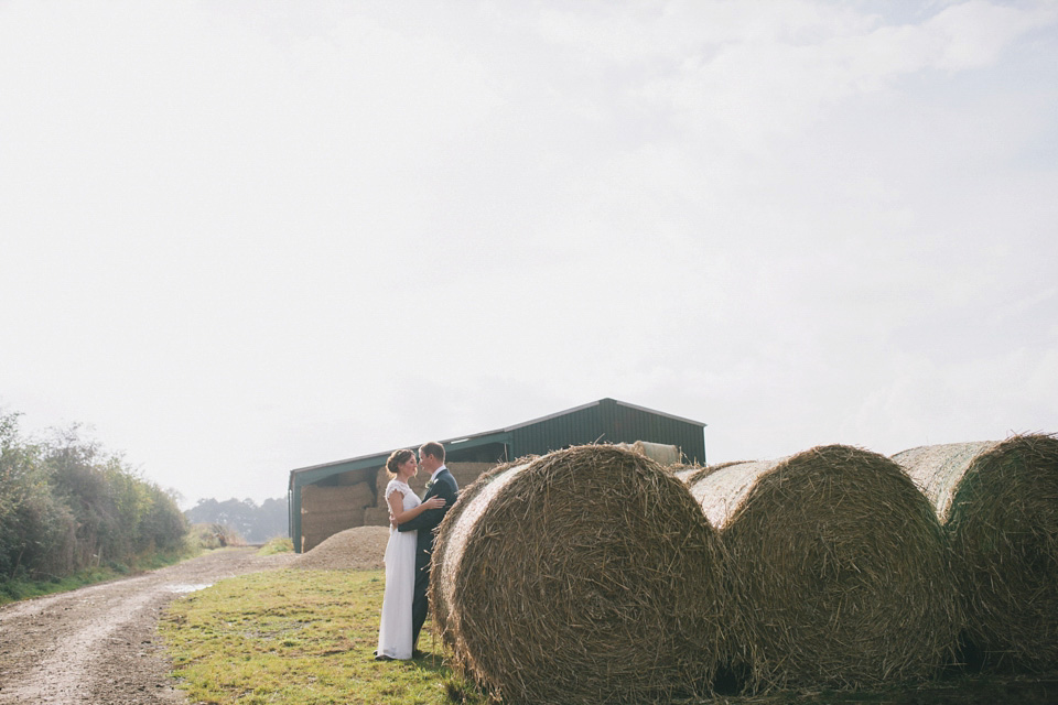 An elegant rustic Autumn wedding with a bride wearing flowers in her hair. Photography by Sally T.