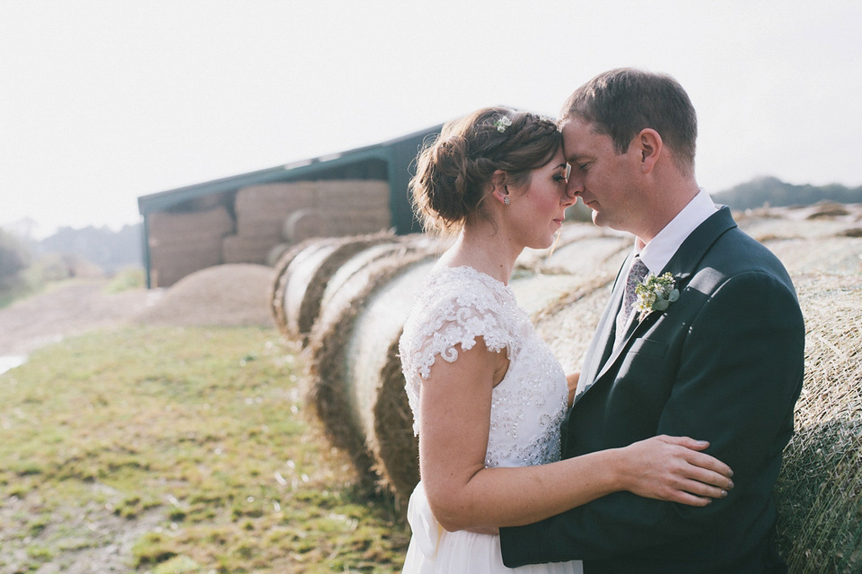 An elegant rustic Autumn wedding with a bride wearing flowers in her hair. Photography by Sally T.