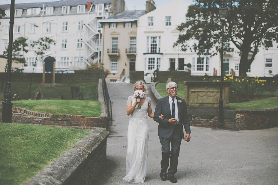 A bride wearing Eden by Jenny Packham for her coastal and rustic inspired wedding at Danby Castle in the North Yorkshire Moors. Photography by James Melia.