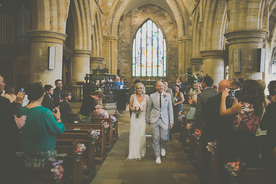 A bride wearing Eden by Jenny Packham for her coastal and rustic inspired wedding at Danby Castle in the North Yorkshire Moors. Photography by James Melia.