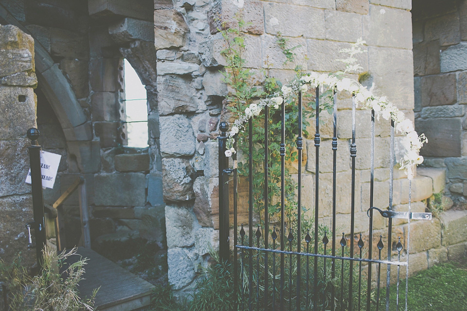 A bride wearing Eden by Jenny Packham for her coastal and rustic inspired wedding at Danby Castle in the North Yorkshire Moors. Photography by James Melia.