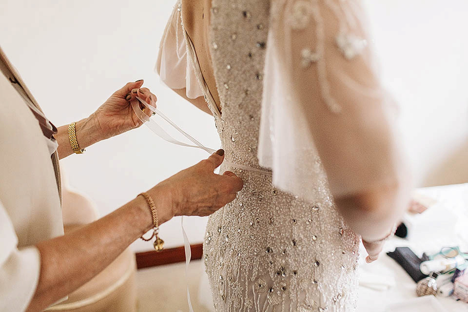 The bride wears Anoushka G for her relaxed, family focussed Spring wedding at Riddlesden Hall in West Yorkshire. Photography by Paul Joseph.