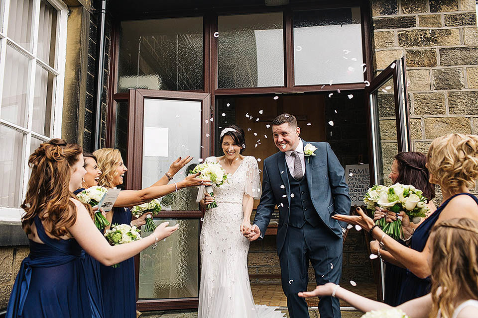 The bride wears Anoushka G for her relaxed, family focussed Spring wedding at Riddlesden Hall in West Yorkshire. Photography by Paul Joseph.