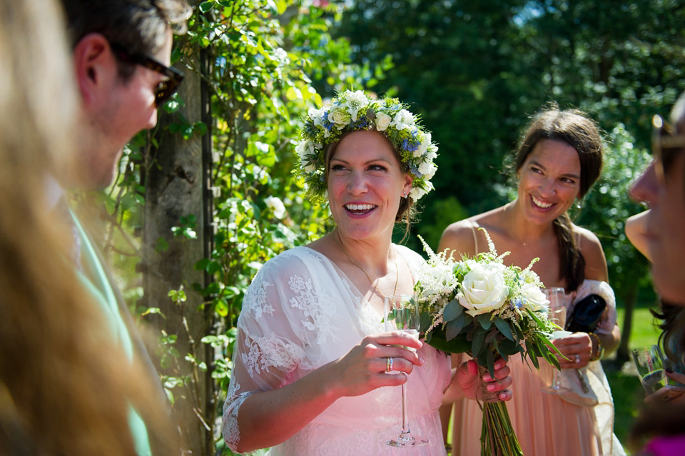 A Sally Lacock wedding dress made from romantic lace, for a pretty Summer garden wedding on the Isle of Wight. Photography by Especially Amy.