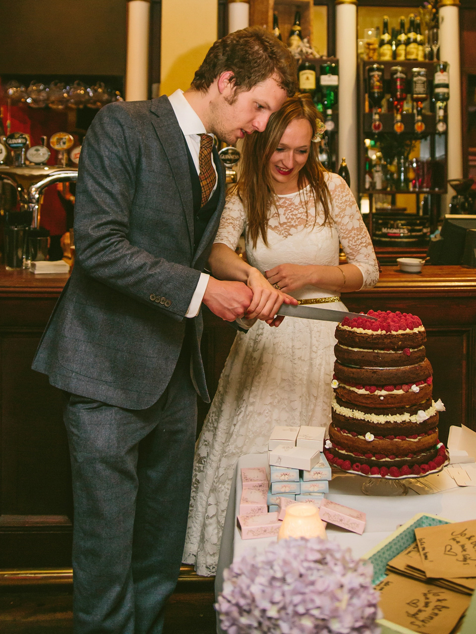 The bride wears a 1950's vintage inspired wedding dress by Fur Coat No Knickers for their very British London pub wedding. Photography by Marc Hayden.