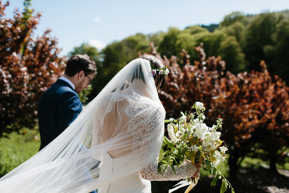 The bride wears 'Olsen' by Rime Arodaky, a purchase from The Mews Notting Hill, for her Scottish country house wedding at Eastwood House. Photography by Caro Weiss.