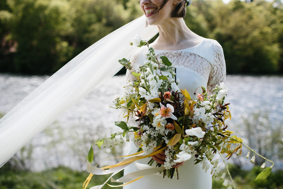 The bride wears 'Olsen' by Rime Arodaky, a purchase from The Mews Notting Hill, for her Scottish country house wedding at Eastwood House. Photography by Caro Weiss.