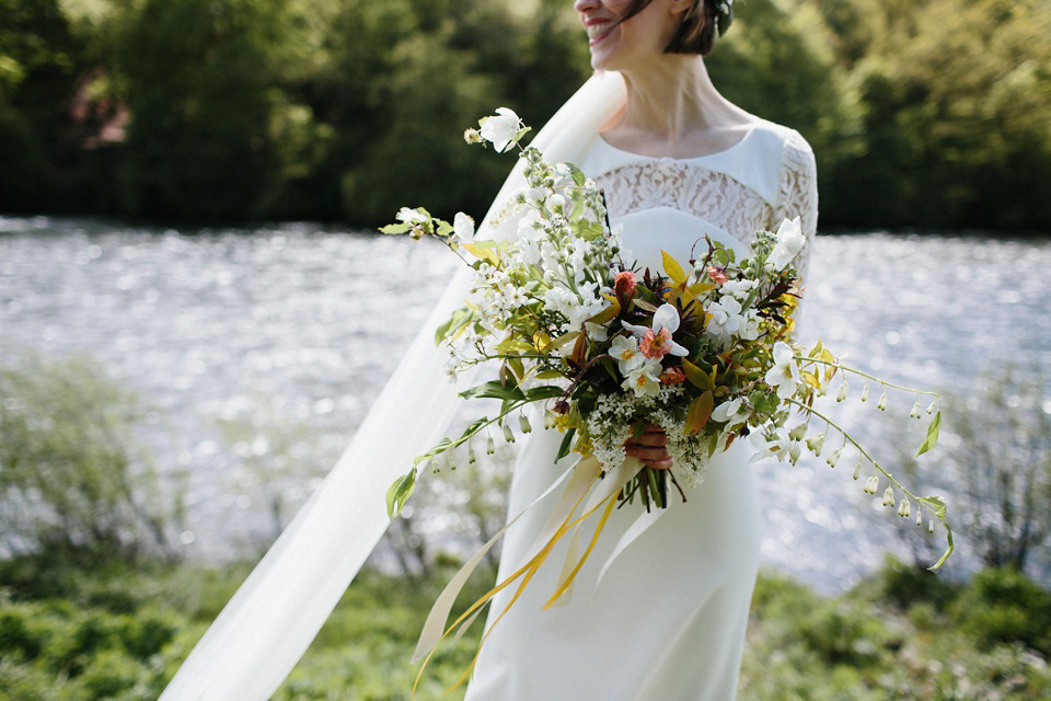 The bride wears 'Olsen' by Rime Arodaky, a purchase from The Mews Notting Hill, for her Scottish country house wedding at Eastwood House. Photography by Caro Weiss.