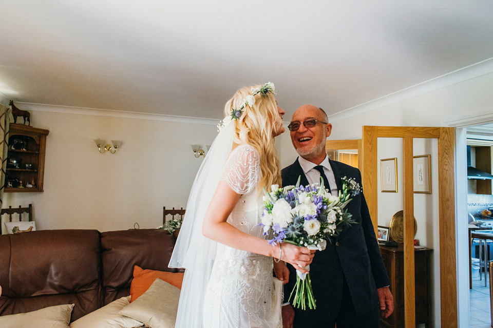 A pretty pale blue summer Barn wedding. The bride wears Jenny Packham and a floral crown. Image by Babb Photography