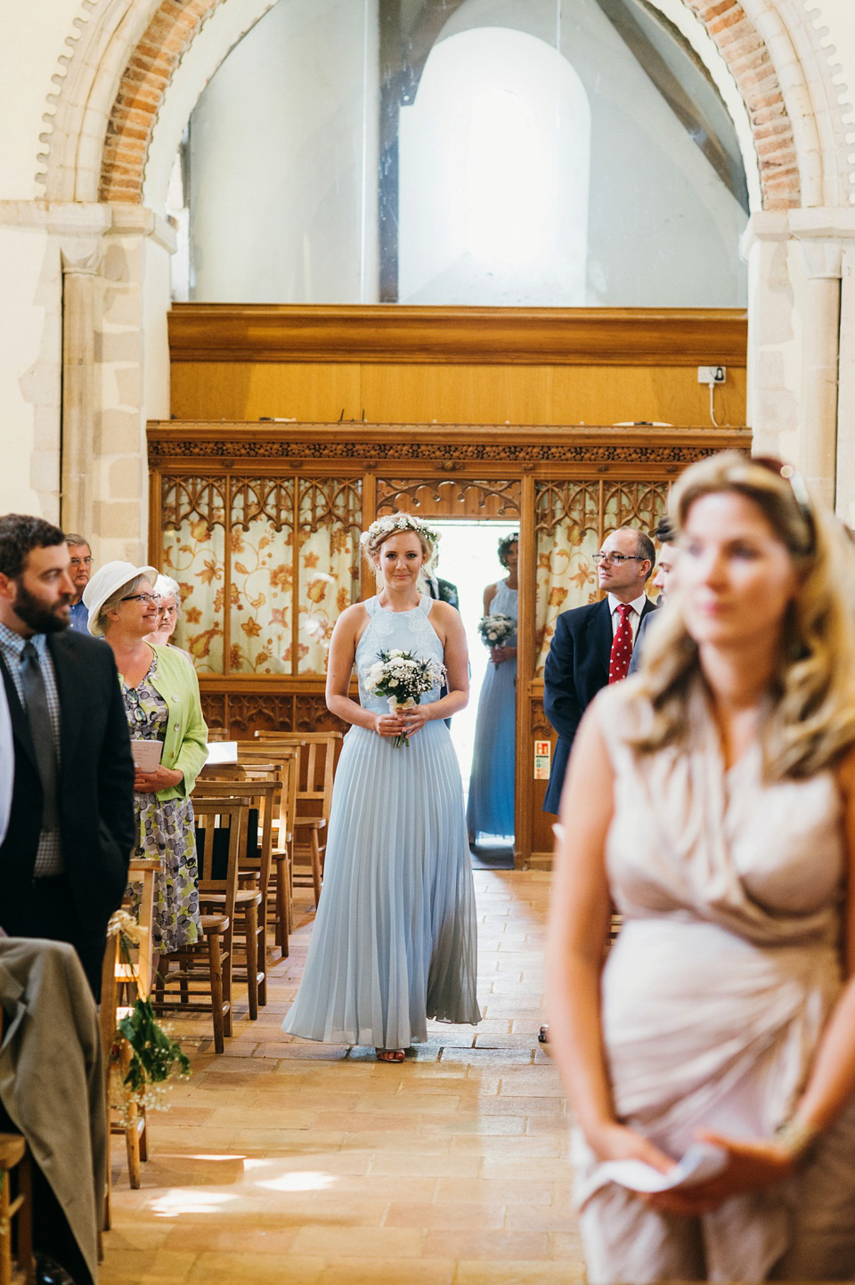 A pretty pale blue summer Barn wedding. The bride wears Jenny Packham and a floral crown. Image by Babb Photography