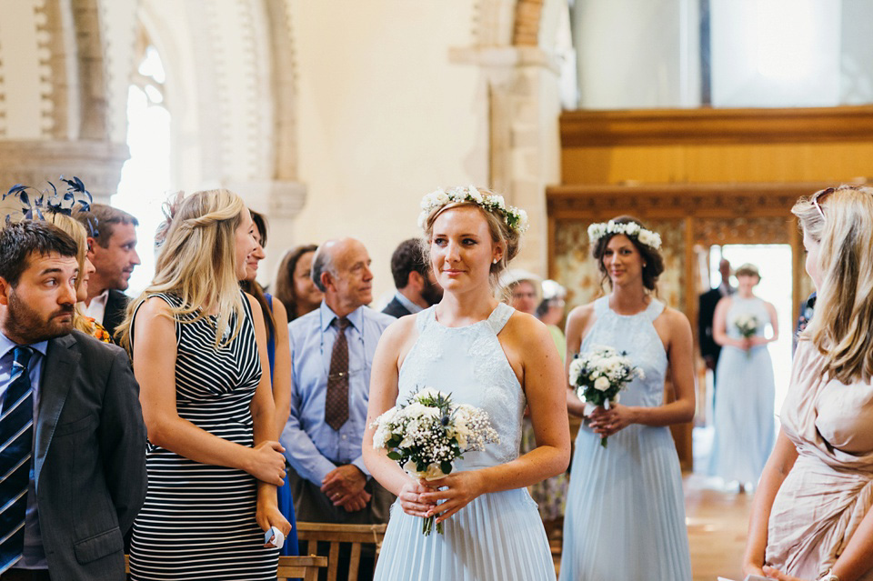 A pretty pale blue summer Barn wedding. The bride wears Jenny Packham and a floral crown. Image by Babb Photography