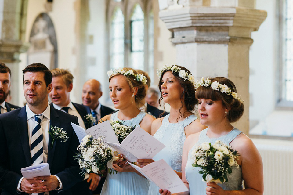 A pretty pale blue summer Barn wedding. The bride wears Jenny Packham and a floral crown. Image by Babb Photography