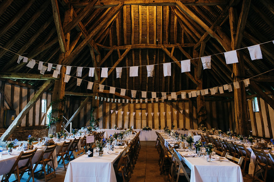 A pretty pale blue summer Barn wedding. The bride wears Jenny Packham and a floral crown. Image by Babb Photography