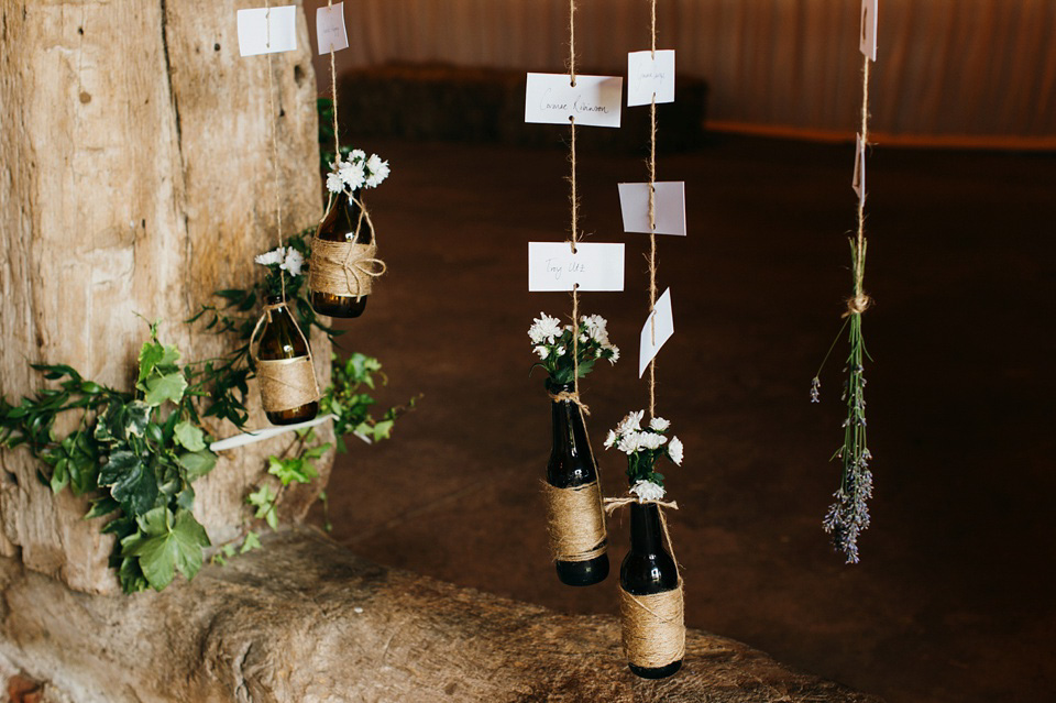 A pretty pale blue summer Barn wedding. The bride wears Jenny Packham and a floral crown. Image by Babb Photography