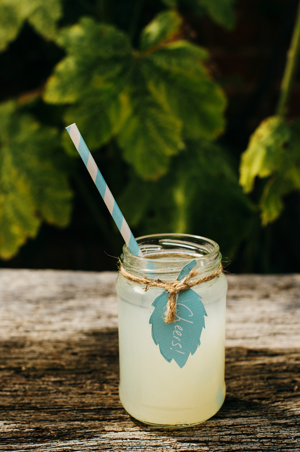 A pretty pale blue summer Barn wedding. The bride wears Jenny Packham and a floral crown. Image by Babb Photography