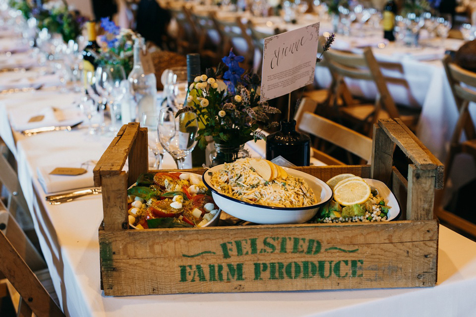 A pretty pale blue summer Barn wedding. The bride wears Jenny Packham and a floral crown. Image by Babb Photography