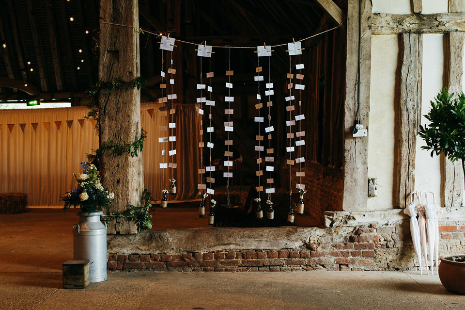 A pretty pale blue summer Barn wedding. The bride wears Jenny Packham and a floral crown. Image by Babb Photography