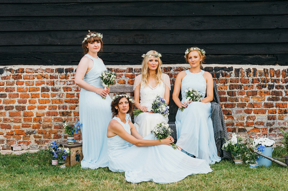 A pretty pale blue summer Barn wedding. The bride wears Jenny Packham and a floral crown. Image by Babb Photography