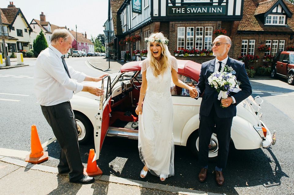 A pretty pale blue summer Barn wedding. The bride wears Jenny Packham and a floral crown. Image by Babb Photography