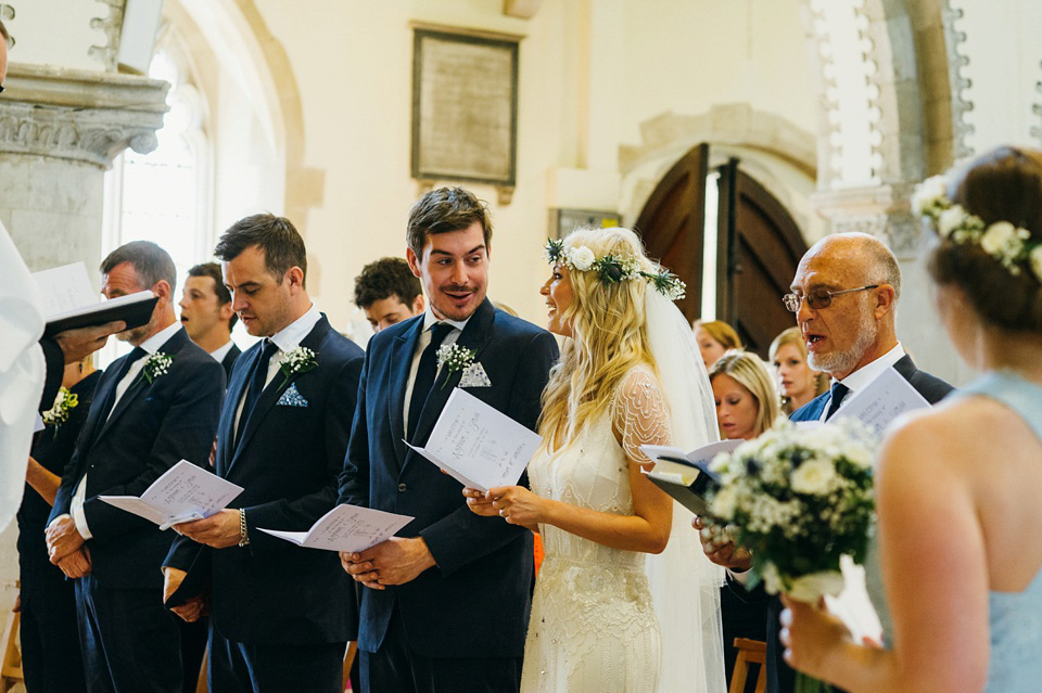 A pretty pale blue summer Barn wedding. The bride wears Jenny Packham and a floral crown. Image by Babb Photography