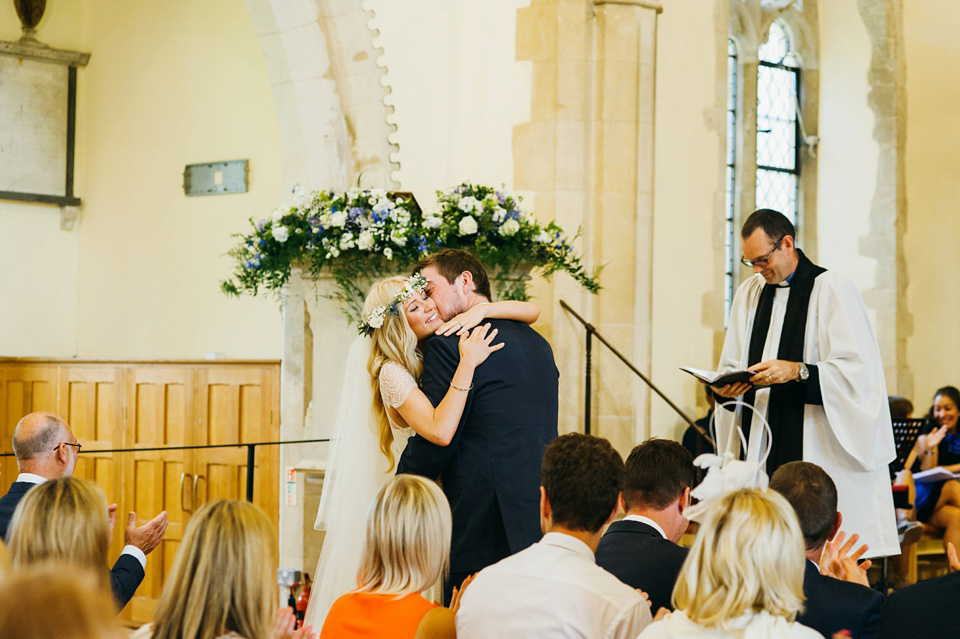 A pretty pale blue summer Barn wedding. The bride wears Jenny Packham and a floral crown. Image by Babb Photography