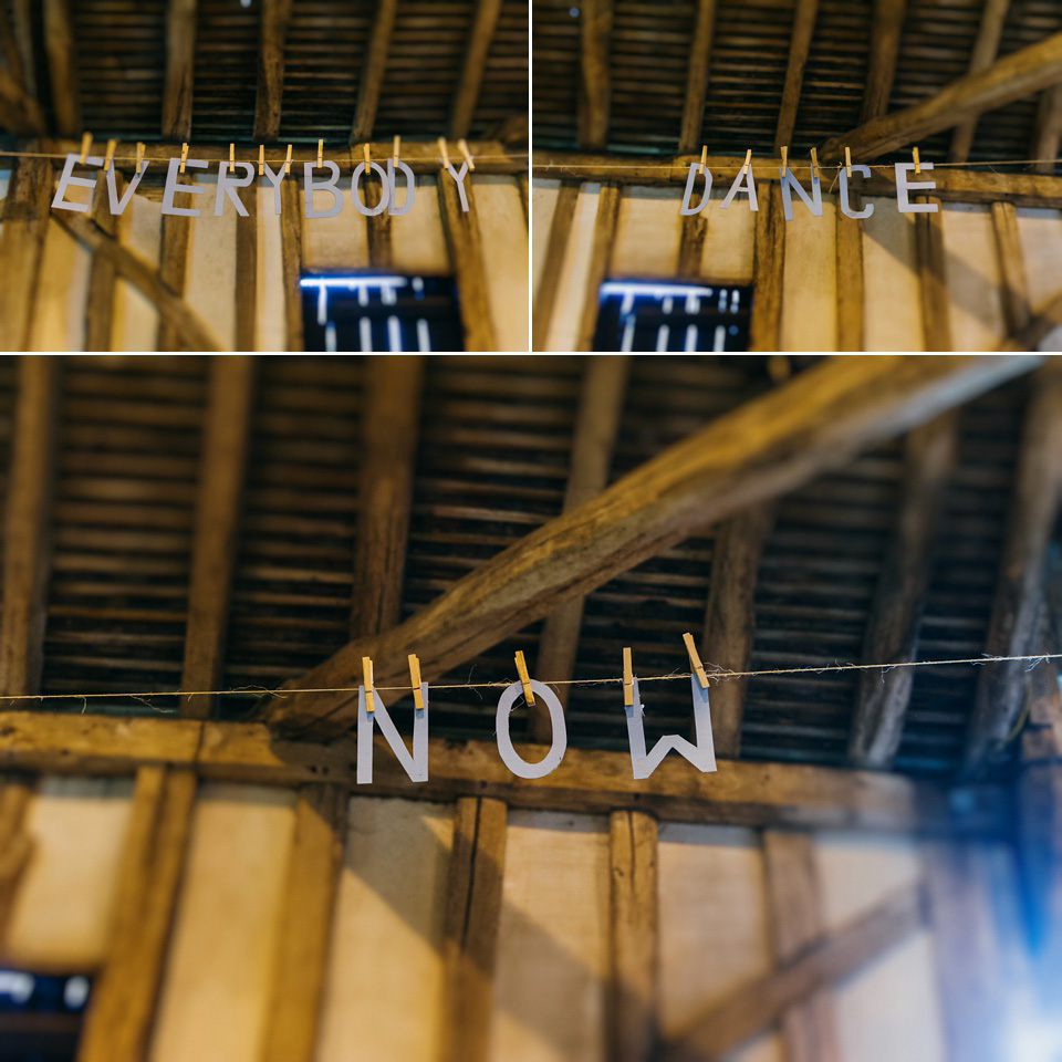 A pretty pale blue summer Barn wedding. The bride wears Jenny Packham and a floral crown. Image by Babb Photography