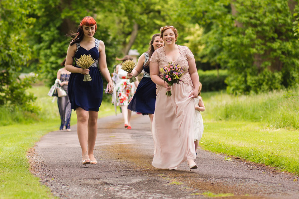 The bride wears a Jacques Vert dress from Debenhams for her Welsh country house wedding.