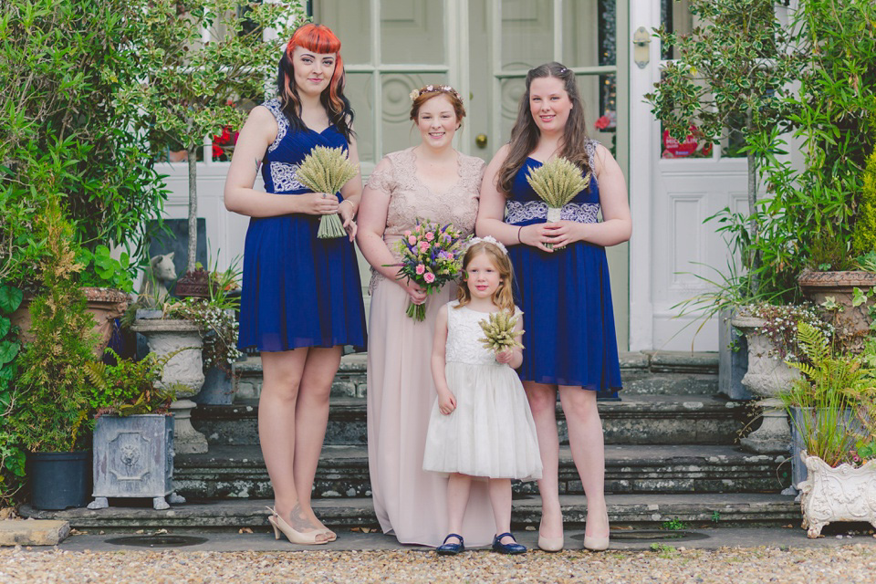 The bride wears a Jacques Vert dress from Debenhams for her Welsh country house wedding.