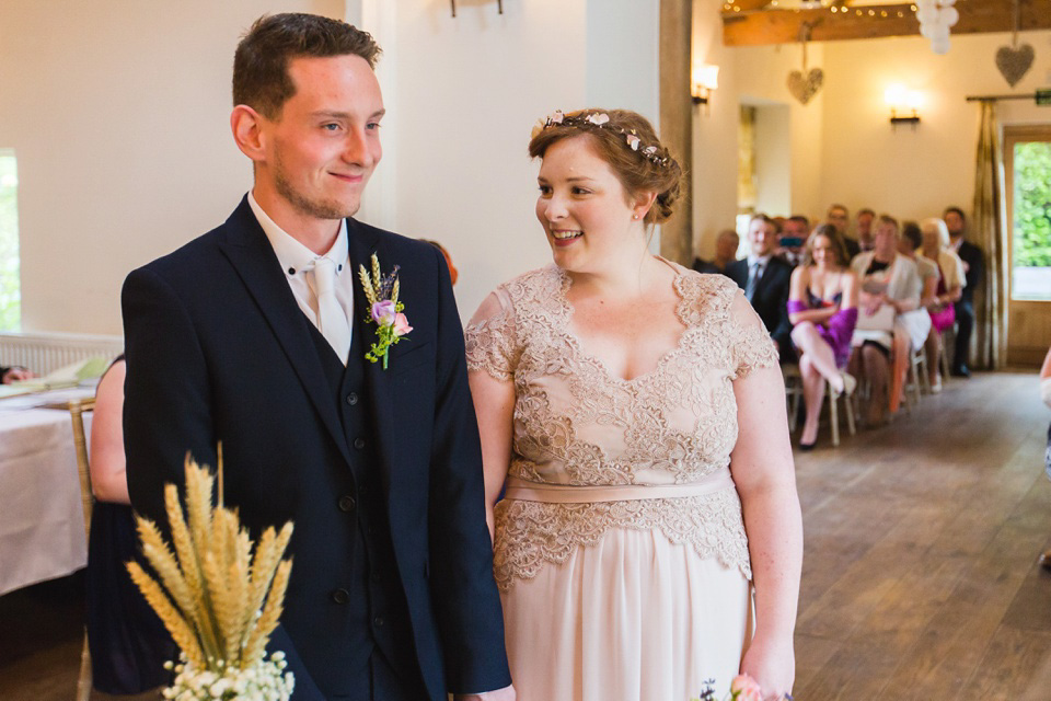 The bride wears a Jacques Vert dress from Debenhams for her Welsh country house wedding.