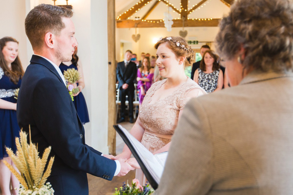 The bride wears a Jacques Vert dress from Debenhams for her Welsh country house wedding.