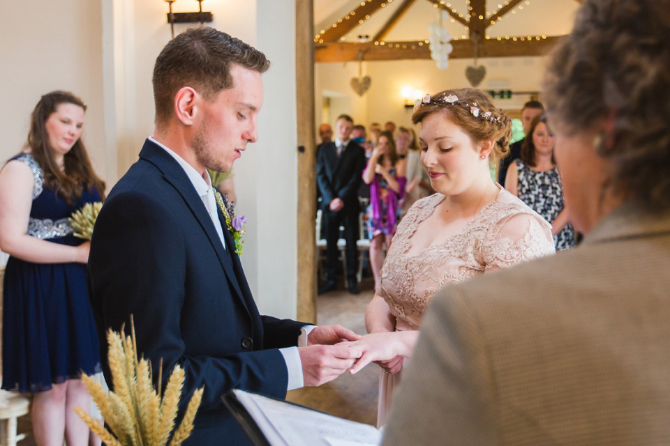 The bride wears a Jacques Vert dress from Debenhams for her Welsh country house wedding.