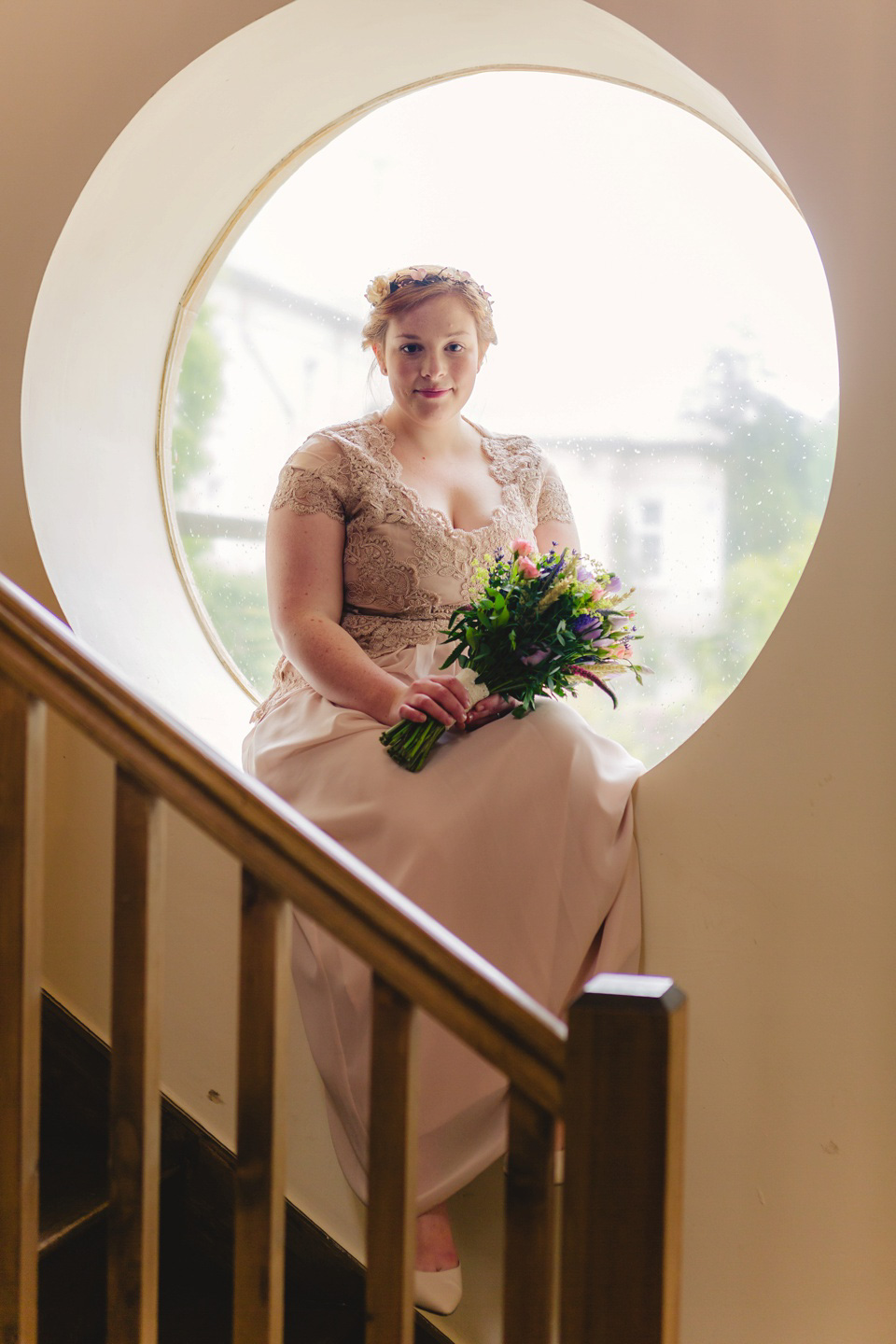 The bride wears a Jacques Vert dress from Debenhams for her Welsh country house wedding.