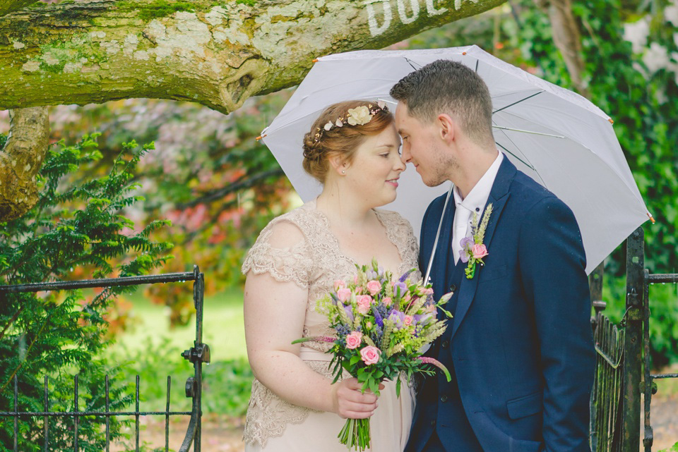 The bride wears a Jacques Vert dress from Debenhams for her Welsh country house wedding.