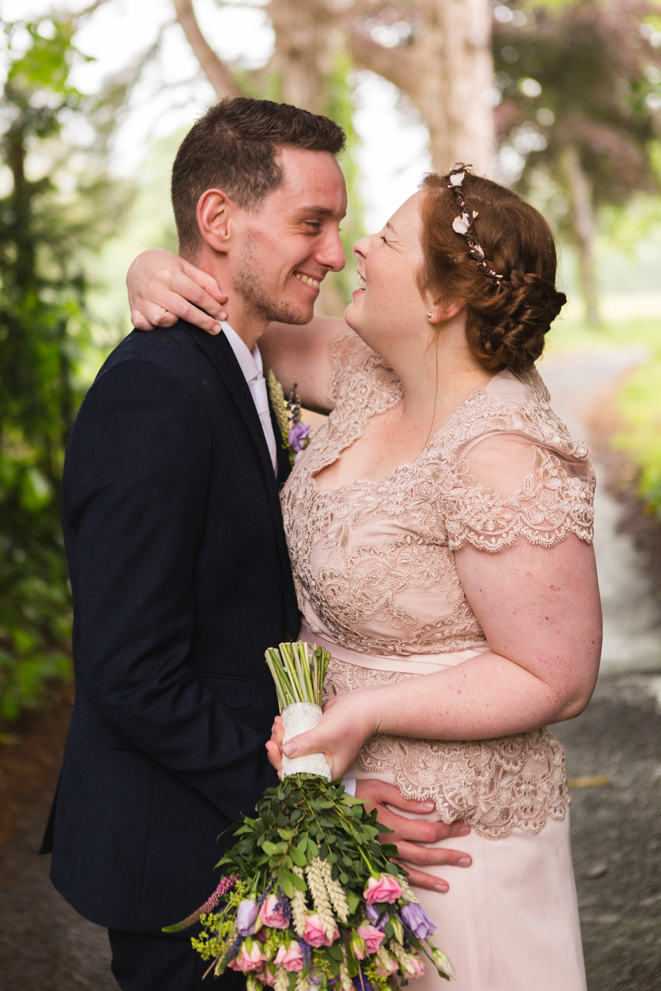 The bride wears a Jacques Vert dress from Debenhams for her Welsh country house wedding.