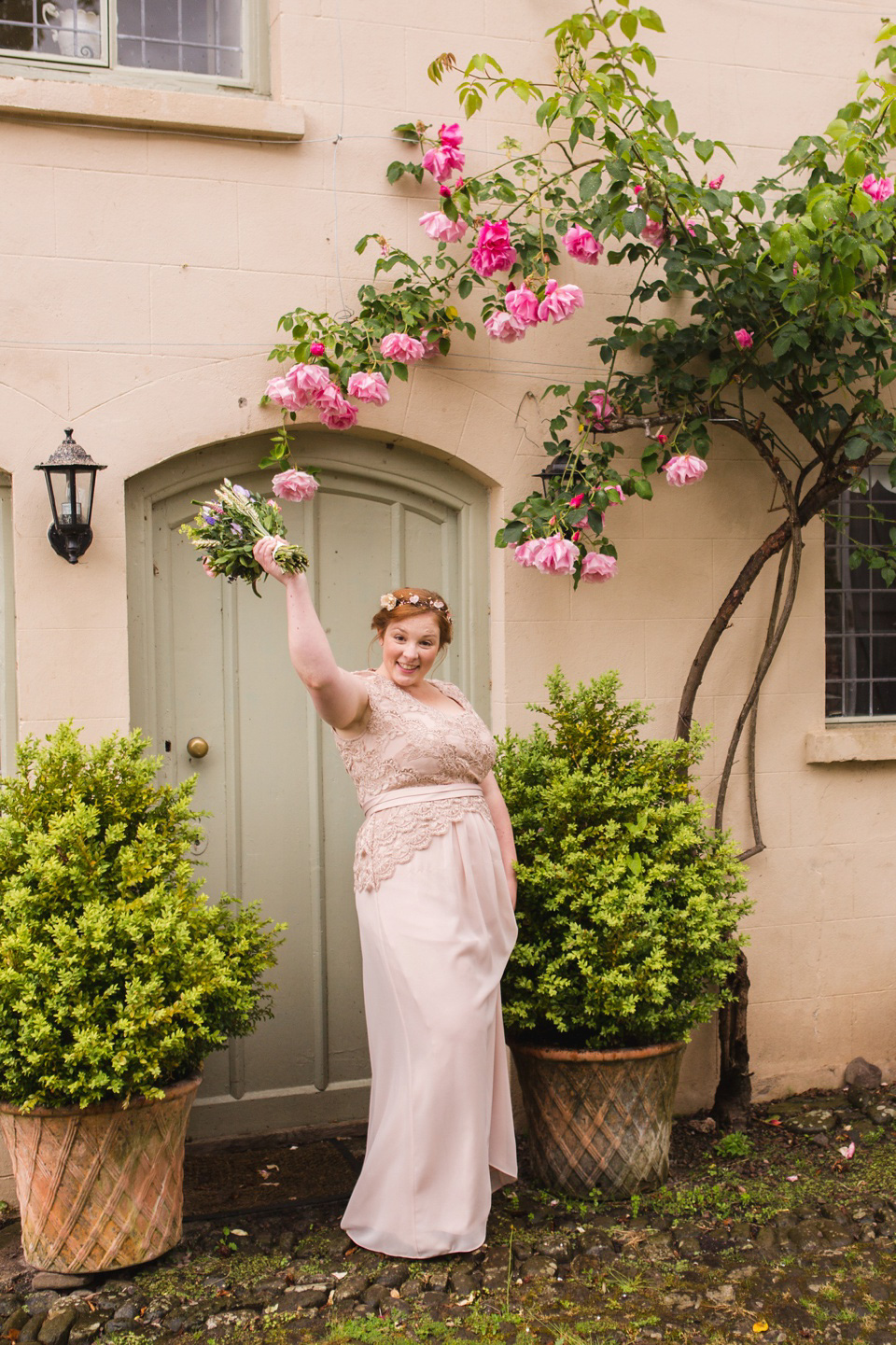 The bride wears a Jacques Vert dress from Debenhams for her Welsh country house wedding.