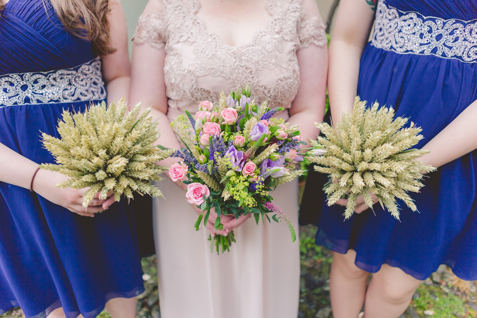 The bride wears a Jacques Vert dress from Debenhams for her Welsh country house wedding.