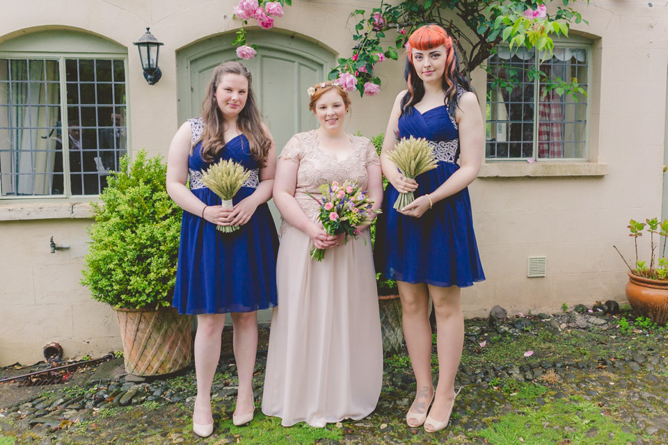 The bride wears a Jacques Vert dress from Debenhams for her Welsh country house wedding.