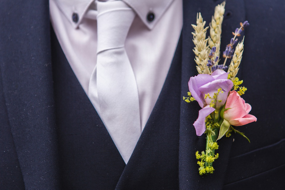 The bride wears a Jacques Vert dress from Debenhams for her Welsh country house wedding.