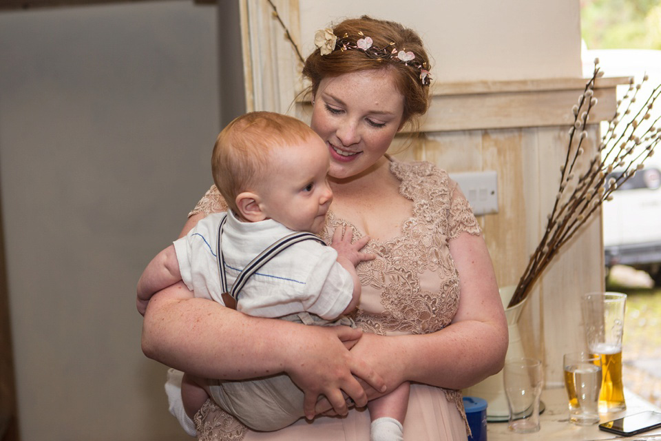 The bride wears a Jacques Vert dress from Debenhams for her Welsh country house wedding.