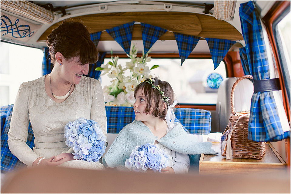 The bride wears a 1930s original vintage wedding gown for her village hall wedding in Scotland. Photography by Michelle Turnbull.