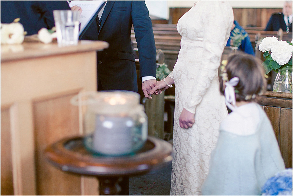 The bride wears a 1930s original vintage wedding gown for her village hall wedding in Scotland. Photography by Michelle Turnbull.